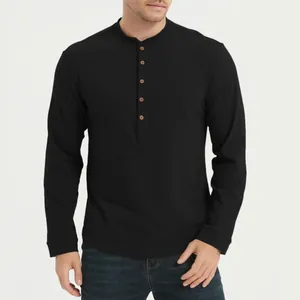 Close-up detail of a men's black long-sleeved Henley shirt with button neckline