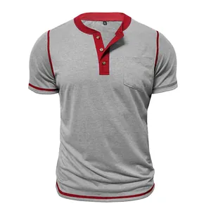 Close-up of a men's grey and red color block Henley T-shirt featuring a front chest pocket