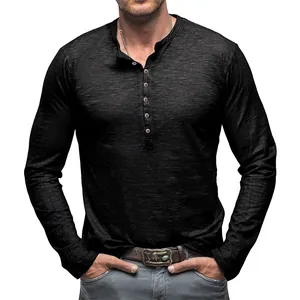 Detail view of a men's black slub cotton long sleeve Henley shirt with button collar.