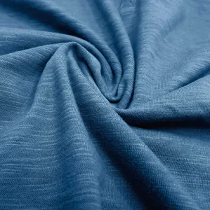 Close-up of breathable blue slub cotton fabric texture for men's casual Henley shirt