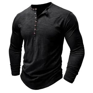 Close-up detail of black slub cotton long sleeve Henley shirt with wooden buttons.