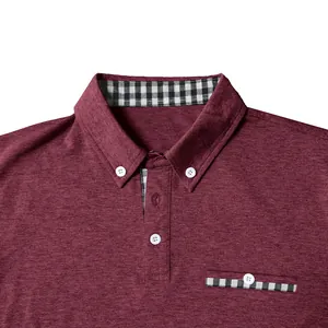 Close-up detail of a maroon men's polo shirt featuring checkered collar and pocket trim