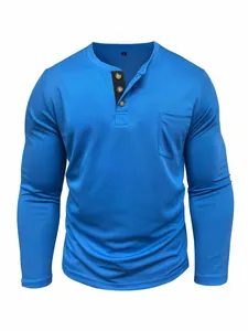 Detailed view of men's blue long-sleeved Henley shirt with buttoned pocket