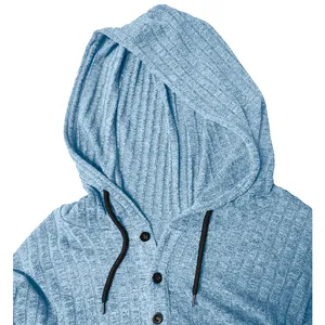 Detail view of light blue ribbed hooded shirt with buttoned neckline and drawstrings