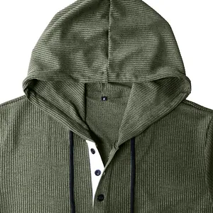 Detailed view of olive green men's ribbed hooded Henley shirt with white button placket