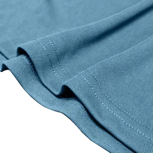 Close-up detail of the breathable blue mesh fabric and stitching on a men's polo shirt