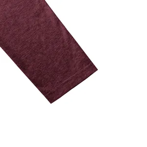 Close-up of heathered burgundy sleeve cuff with double stitching on men's polo shirt