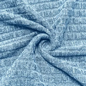 Macro detail showing the soft blue ribbed knit fabric texture of a men's casual hoodie