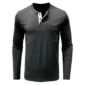 Close-up of charcoal gray men's Henley shirt with chest pocket and white collar lining.