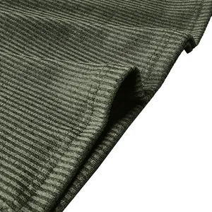 Close-up macro view showing texture of olive green ribbed knit fabric on men's shirt