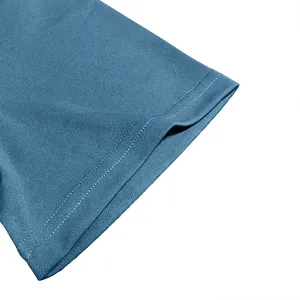 Close-up of piqué fabric texture and double-stitched cuff on men's blue polo shirt