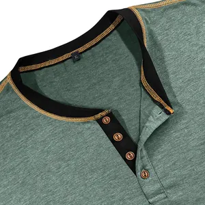Close-up of green Henley shirt detail with four wood-look buttons and black collar