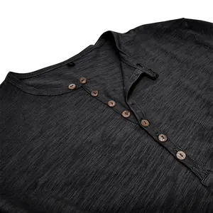 Detailed macro view of men's charcoal grey Henley shirt featuring slub cotton fabric texture