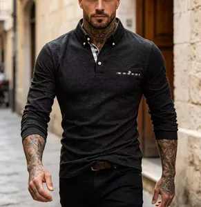 Close-up of men's charcoal polo shirt showing plaid collar detail and textured fabric