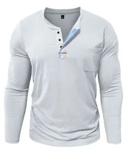 Men's gray long-sleeve Henley shirt detail featuring contrast blue placket and chest pocket