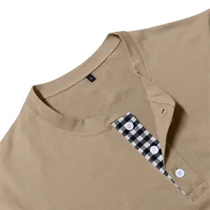 Close-up detail of men's khaki Henley shirt with black and white gingham placket
