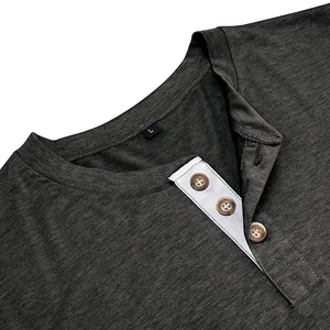Close-up view of the button placket and collar detail of a grey men's cotton Henley shirt