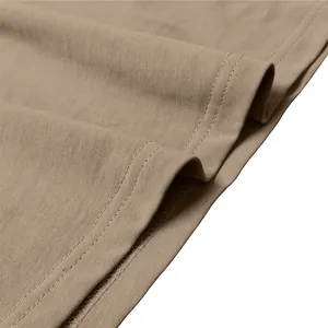 Detailed macro shot of khaki men's Henley T-shirt fabric showing neat double-needle stitching