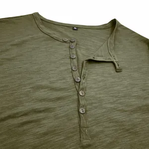 Close-up detail of olive green slub cotton Henley t-shirt with button neckline