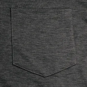 Close-up detail of the chest pocket on a dark gray breathable cotton men's T-shirt