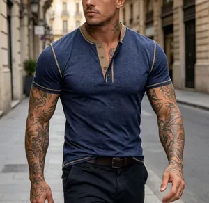 Detailed view of a blue short-sleeved Henley shirt with tan contrast stitching and collar.