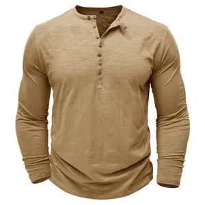 Men's long sleeve Henley shirt in tan slub cotton featuring multi-button neck detail.