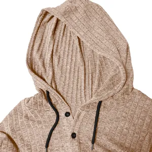 Close-up of men's ribbed hooded T-shirt with black drawstring and button detail
