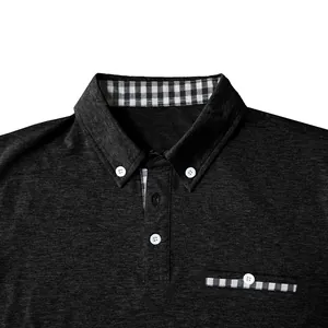 Macro view of a grey polo shirt featuring a checkered collar and button-down detail.