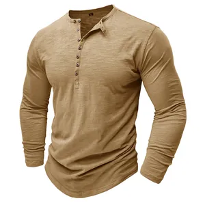 Close-up of slub cotton texture on khaki men's long sleeve Henley shirt