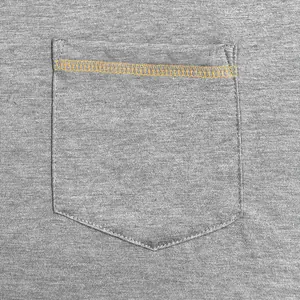Close-up of men's grey t-shirt pocket with orange contrast stitching