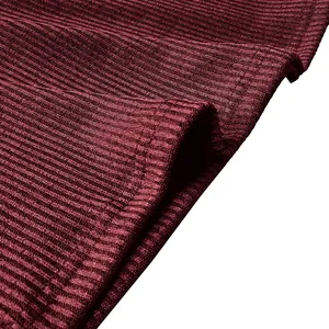 Close-up macro shot of wine red ribbed knit fabric showing detailed texture and quality