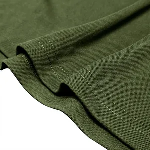 Detailed macro view of olive green breathable pique knit fabric on a men's polo shirt