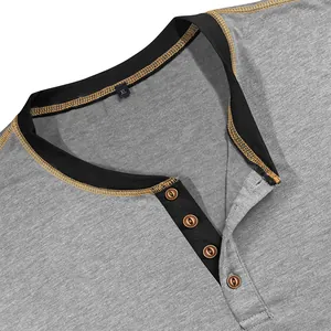 Close-up of men's Henley shirt neckline with color block and buttons