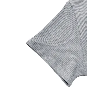 Close-up detail of the premium grey ribbed fabric texture on a men's t-shirt sleeve