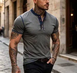 Macro detail of men's casual gray Henley shirt featuring navy contrast trim and button neckline