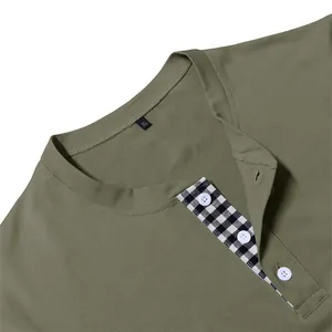 Close-up of men's olive green Henley shirt collar with black and white plaid placket