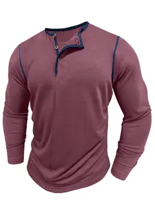 Close-up of a men's long-sleeved Henley shirt in burgundy with navy blue trim.