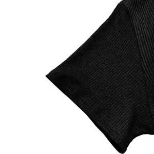 Detailed close-up of black ribbed sleeve texture on men's short sleeve t-shirt top