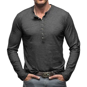 Detailed view of a dark grey slub cotton long sleeve Henley shirt with front button closure