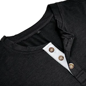 Detailed view of black men's long sleeve Henley shirt neckline featuring three wood-like buttons