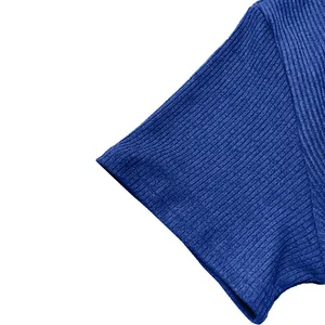 Close-up detailed view of the blue ribbed knit fabric on a men's short sleeve casual shirt
