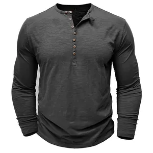 Close-up of men's dark grey long sleeve Henley shirt made from textured slub cotton fabric