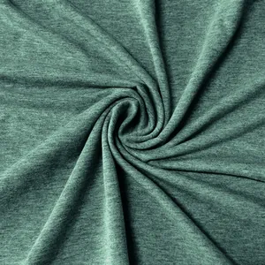 Macro view of soft green heathered fabric texture for men's casual polo shirt
