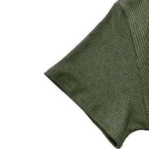 Detailed close-up view of olive green ribbed fabric on men's short-sleeve t-shirt