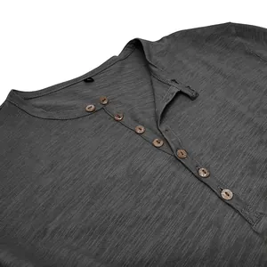 Close-up detail of gray men's Henley shirt showing slub cotton texture and buttons