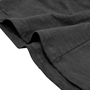 Close-up of slub cotton texture and fine stitching on dark grey men's long sleeve Henley shirt