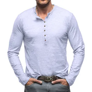 Close-up detail of men's long sleeve slub cotton Henley shirt with buttoned collar