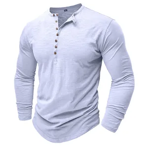 Detail of men's long sleeve Henley shirt featuring wooden buttons and slub cotton fabric