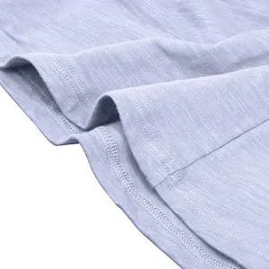 Macro view of the breathable slub cotton fabric and hem stitching on a men's Henley shirt.