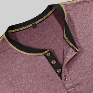 Close-up of men's heather maroon Henley T-shirt with black trim and four buttons